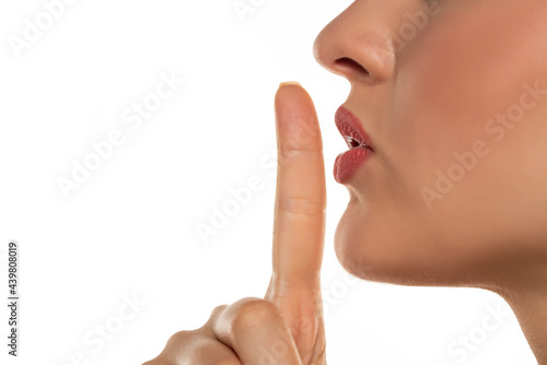 woman making a hush gesture photo