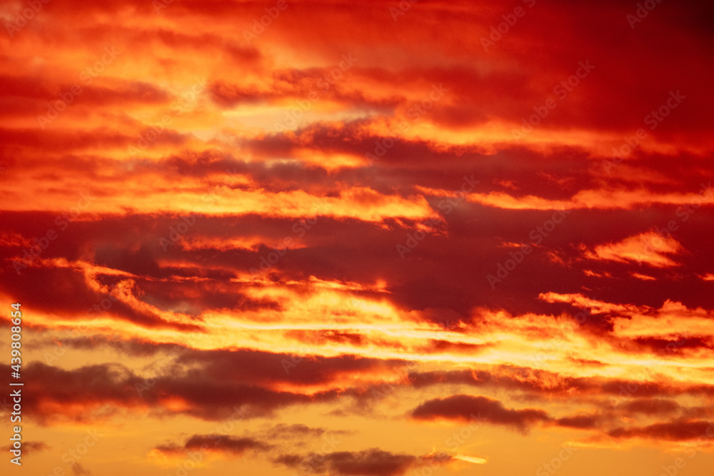 Summer sunset clouds with vivid orange and yellow colours