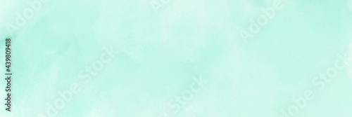 Mint green gradient watercolor background. Hand drawn aquarelle texture. Light green background