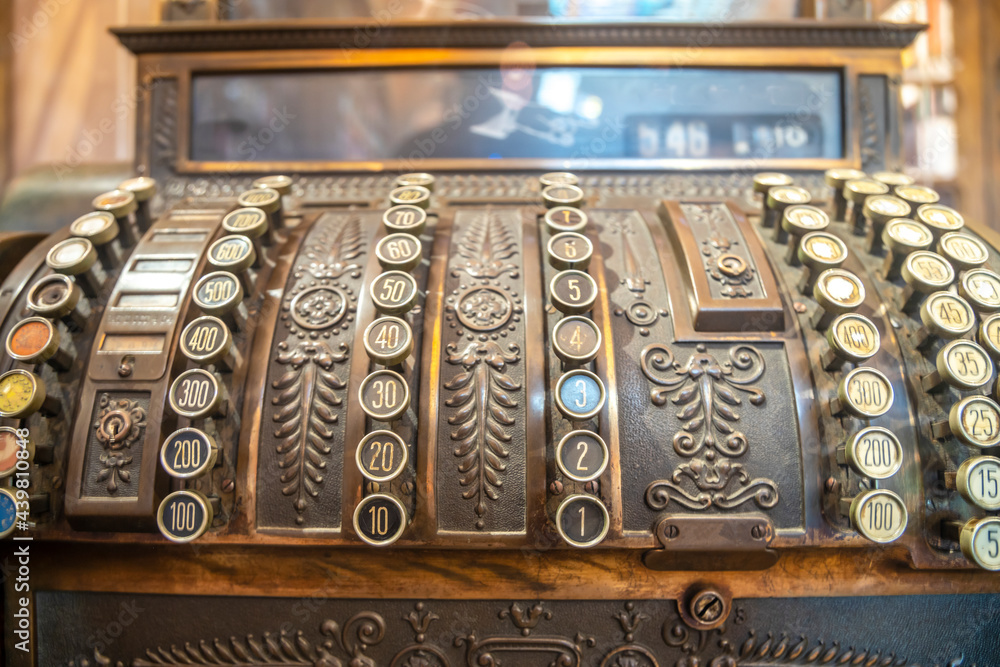 Vintage register machine beautifully decorated .