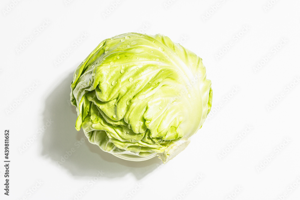 Fresh young cabbage, whole head isolated in white background Fresh young cabbage, whole head isolated in white background