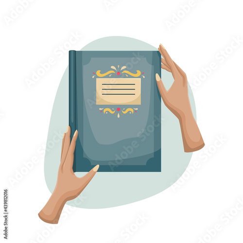 A book in a beautiful retro cover in women's hands. Reading.