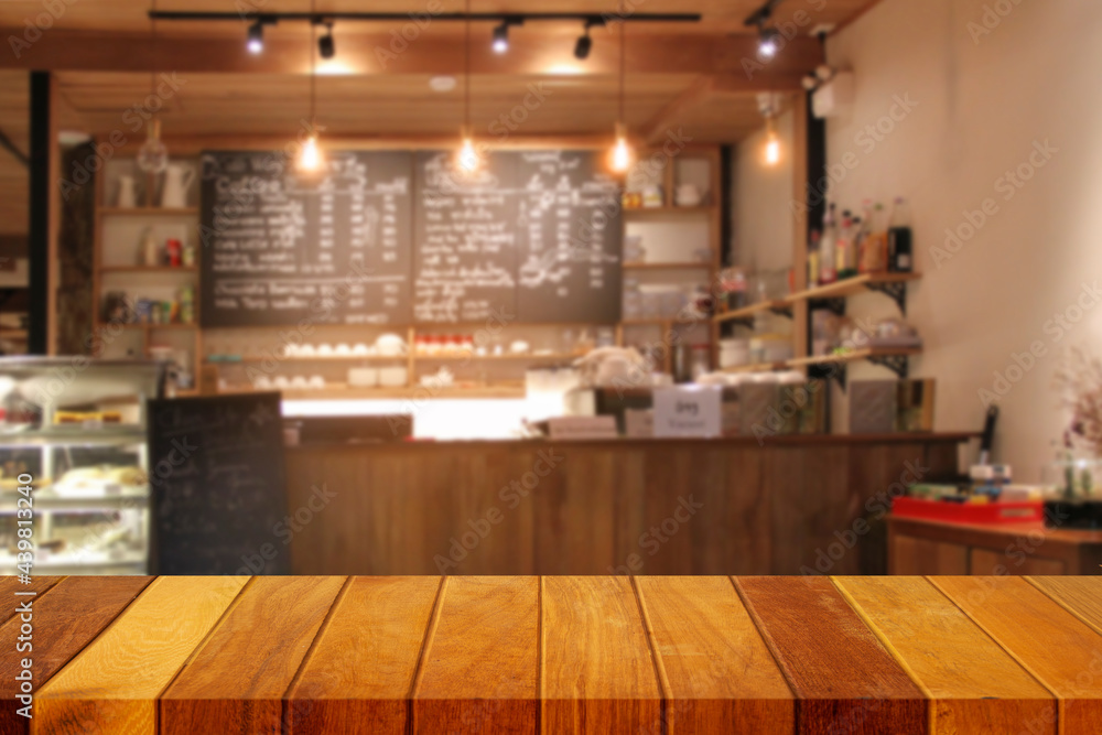 Wooden table top with blur of coffee shop interior or background. (cafe,  restaurant) for editing product display or designing main image layouts.  Stock Photo | Adobe Stock