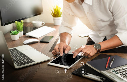 Digital marketing technology on network communication. Businessman hands working with tablet, laptop computer on office desk. Analysis strategy data online connection. Business finance concept.