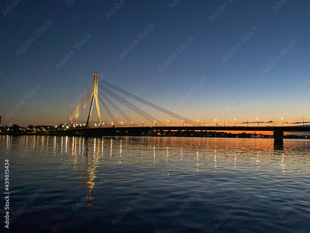 Obraz premium Cable-stayed bridge across the river. The bridge with night lighting.