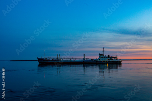 cargo ship at sunset in the bay