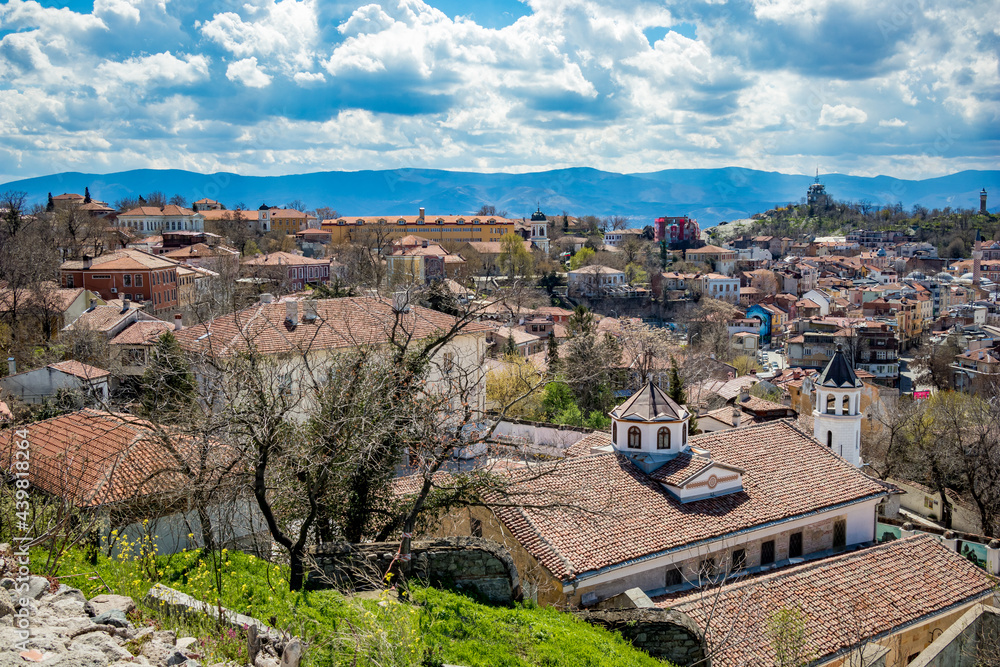 Plovdiv, Bulgaria, elevated cityscape view from Nebet Tepe, one of the city famous hills. Lovely cloudy blue sky.