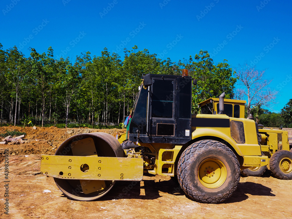 Road roller in power plant during construction. Road roller in power plant during construction.