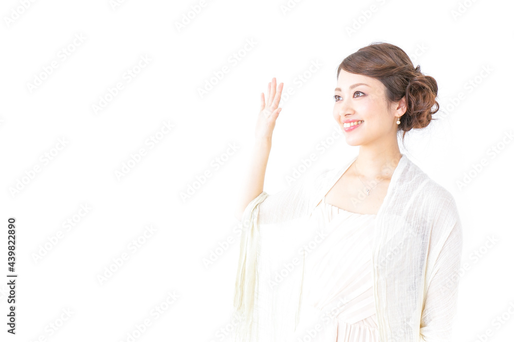 手を振るドレスの女性 手を振るドレスの女性
