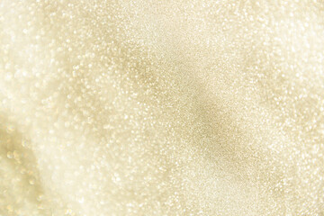 champagne festive glittering christmas lights. Blurred beige abstract background for holidays