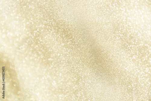 champagne festive glittering christmas lights. Blurred beige abstract background for holidays photo