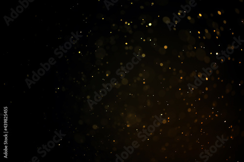 texture of gold dust or drops on a black background, overlay