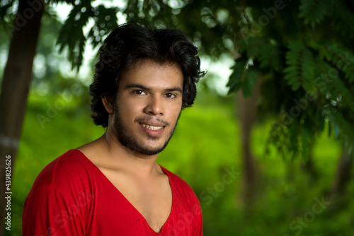 Handsome fashion young man posing outdoors
