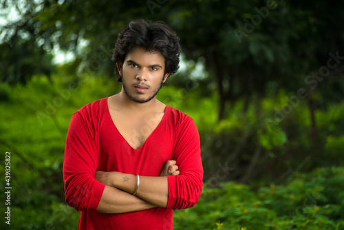 Handsome fashion young man posing outdoors