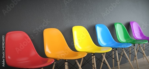фотографія LGBT talk. Several chairs with the colors of the rainbow.