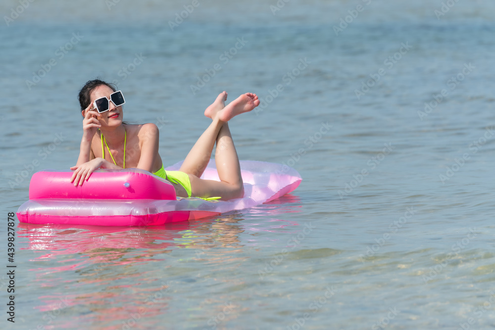 Portrait of thai woman posing outdoors at the sea beach