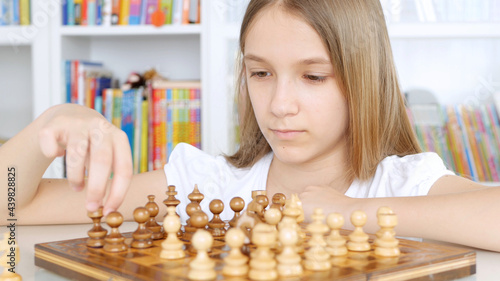 Kid Playing Chess in Library, Child Practicing, Learning, Teenager Blonde Girl Studying Brain Game