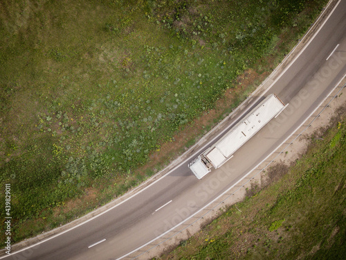 Aerial top down photo. White lorry cargo truck on the highway. Rostov. Russia.