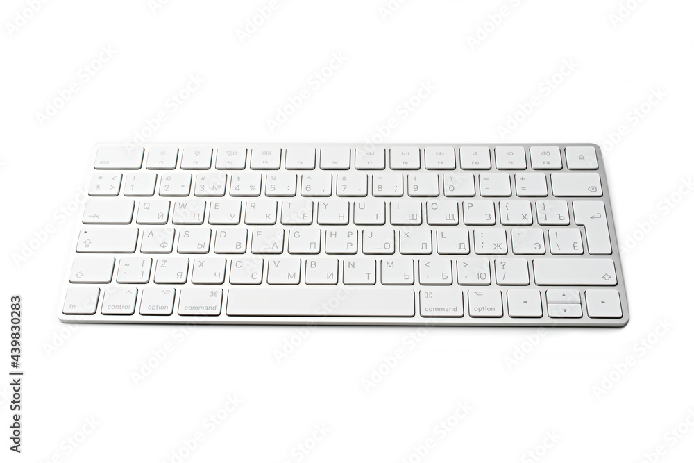 White wireless computer keyboard isolated. Russian-English keyboard layout White wireless computer keyboard isolated. Russian-English keyboard layout