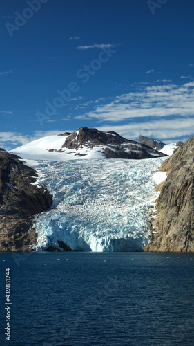 Magnificent landscape with glasier, mountains, sky and sea, Christiansud, Greenland