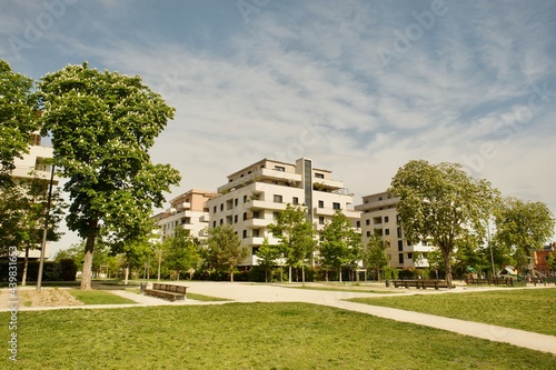modern residential buildings with a large park and playground