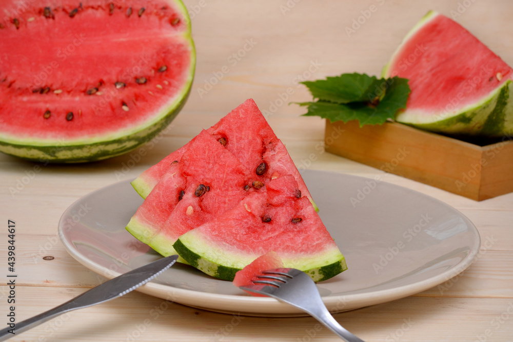 ripe sliced watermelon on a plate close-up ripe sliced watermelon on a plate close-up