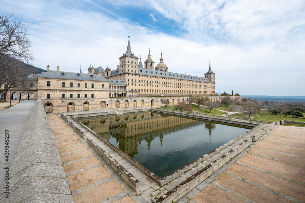 Panoramic of the Monastery of El Escorial with reflection in a rectangular pond