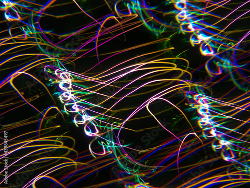 light painting photography, waves of vibrant color against a black background. Long exposure photo of vibrant fairy lights in abstract. abstract color wallpaper	