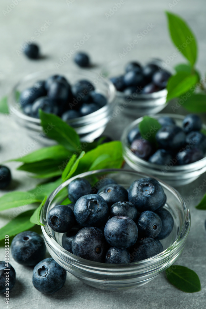 Fresh berry concept with blueberry on gray textured table Fresh berry concept with blueberry on gray textured table
