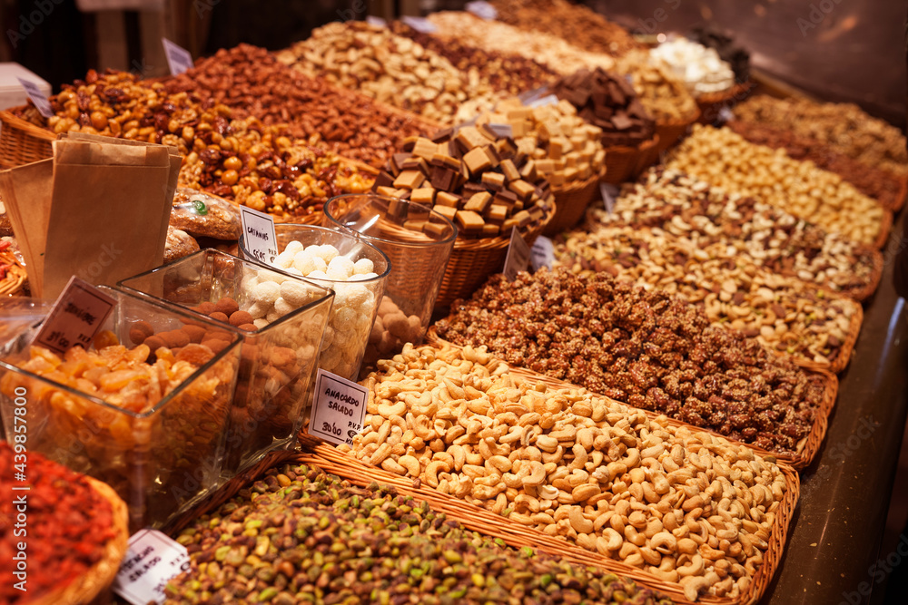 nuts and dried fruits on the counter in the market