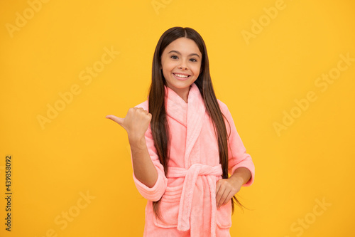 teen pointing finger. girl feeling relaxed and happy. childhood happiness.