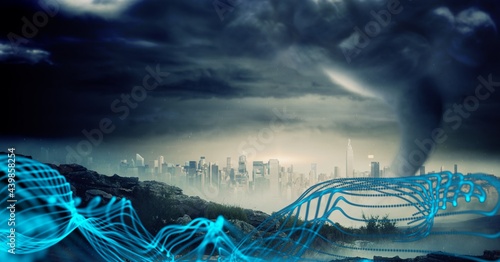 Glowing blue digital waves against thunderstorm and dark clouds against view of cityscape photo