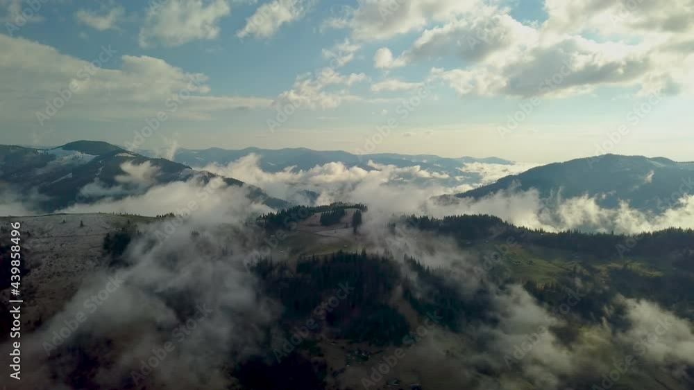 Flying above the clouds in the mountains Flying above the clouds in the mountains