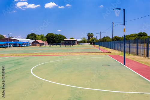 Принти на полотні Empty high school netball court against the clear sky