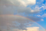 Real rainbow in the summer day . Natural spectrum on the sky 