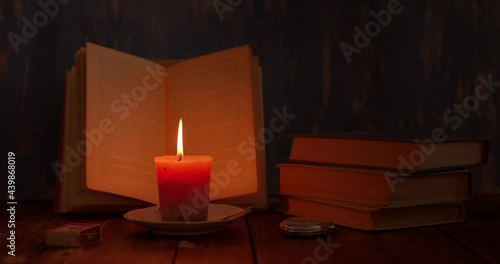 Wallpaper Mural still life, a candle is burning on the table, there is an open book and a clock next to it, retro Torontodigital.ca