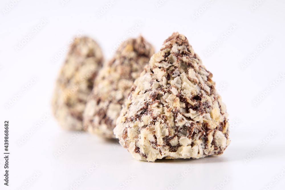 Chocolate candies on a white background. Sweets. Chocolate candies on a white background. Sweets.