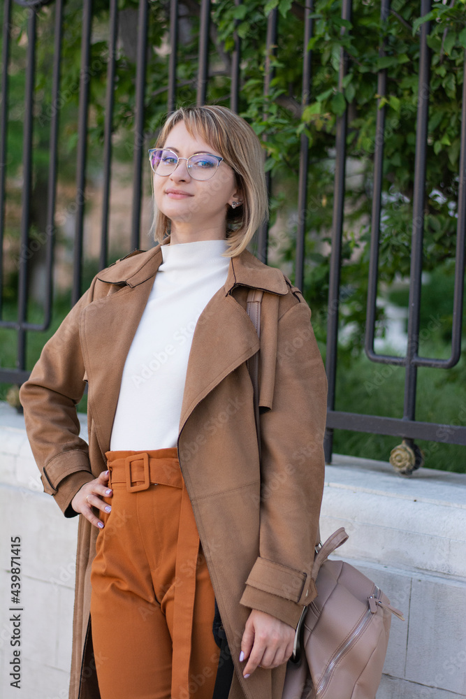 Close up portrait of a blonde woman with a short haircut in glasses in stylish clothes Close up portrait of a blonde woman with a short haircut in glasses in stylish clothes