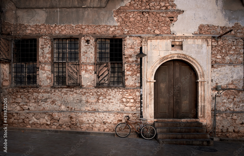 Bicycle by a dilapidated old historic building