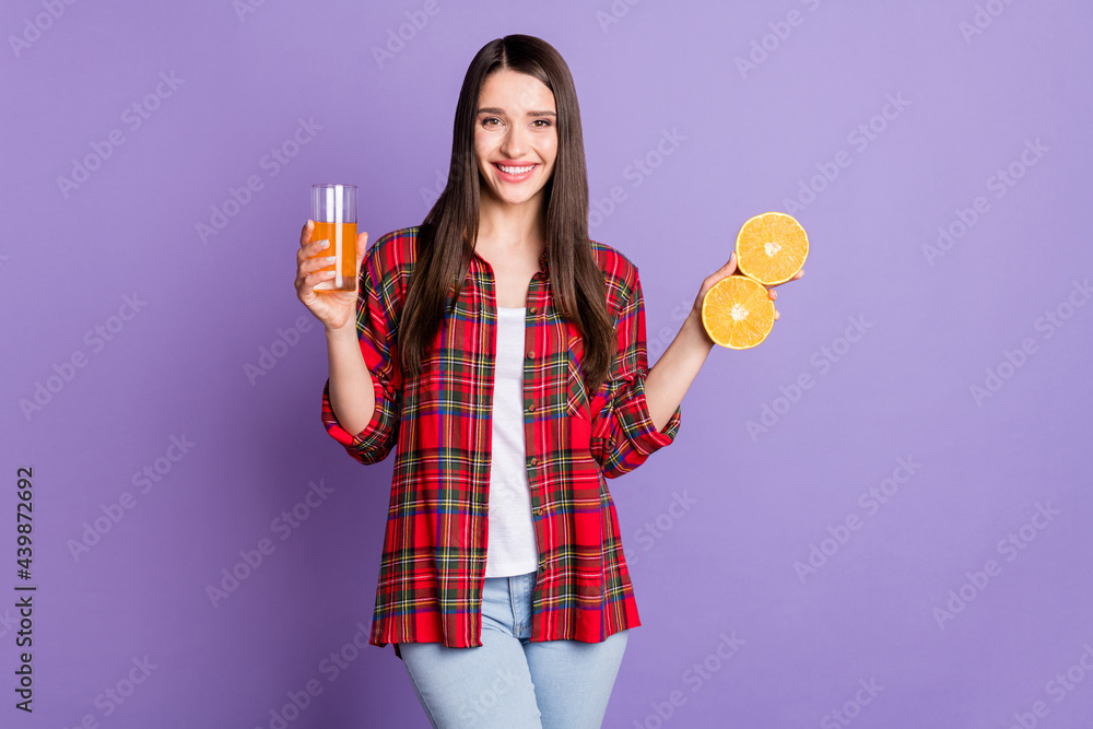 Photo of sweet brunette hairdo young lady hold oranges juice wear red shirt jeans isolated on purple color background Photo of sweet brunette hairdo young lady hold oranges juice wear red shirt jeans isolated on purple color background