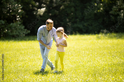 Father chasing his little d...