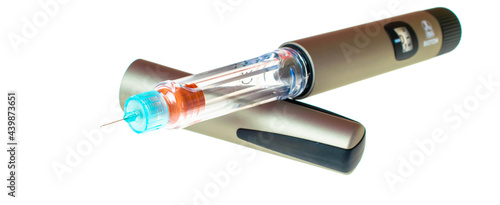 Insulin pen injector.  Insulin pen fill with needle on white background. Diabetes Day. photo