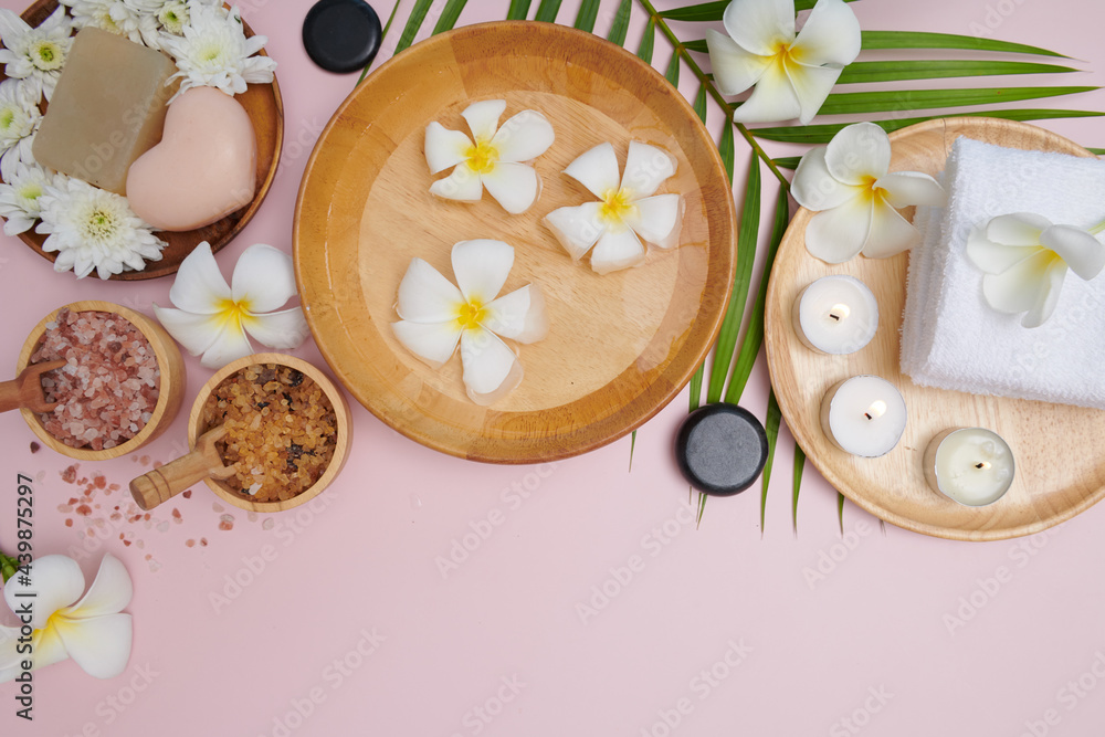 Spa concept. Beauty and fashion concept with spa set. perfumed flowers water. Relaxation and zen, Spa setting flat lay with bowl, bath salt and flowers, towel and natural soap. top view. Spa concept. Beauty and fashion concept with spa set. perfumed flowers water. Relaxation and zen, Spa setting flat lay with bowl, bath salt and flowers, towel and natural soap. top view.