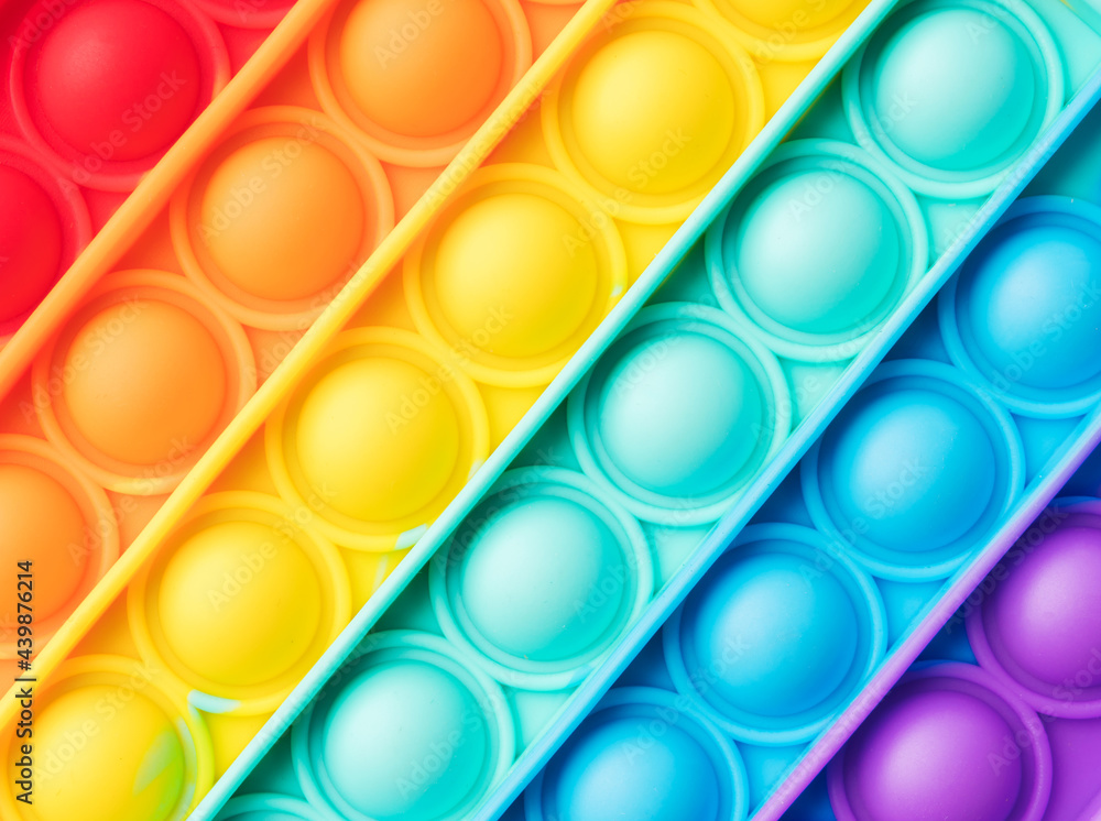 Pop it fidget toy texture rainbow background Pop it fidget toy texture rainbow background