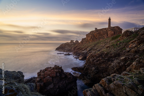 Sunset on lighthouse of Vilan cape in Galicia Spain