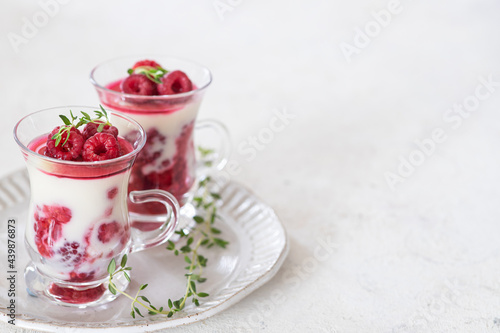 Healthy breakfast: yogurt parfait with fresh raspberries 