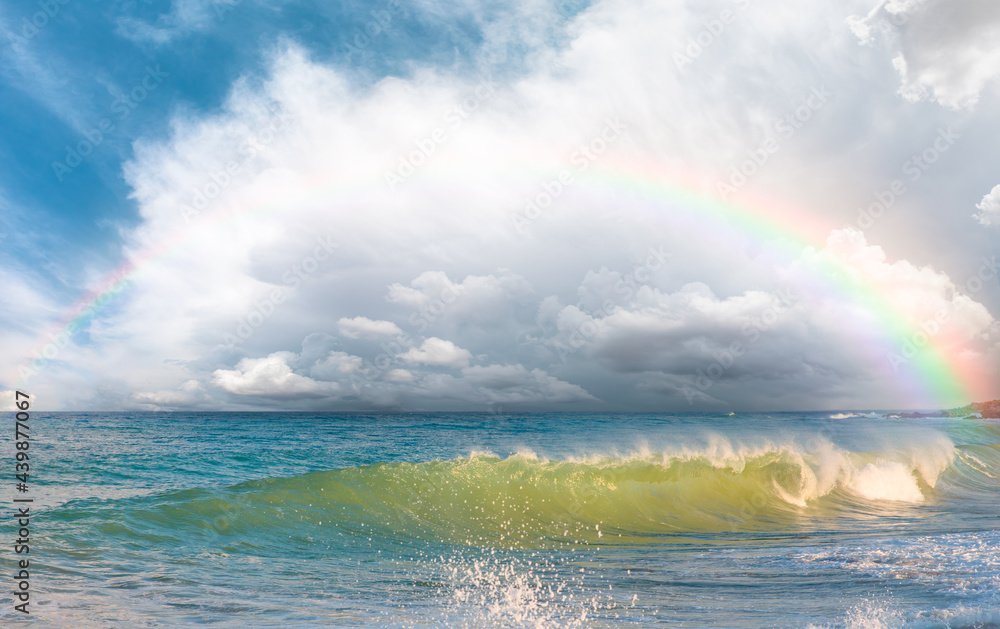 Beautiful landscape with turquoise sea with double sided rainbow at sunset Beautiful landscape with turquoise sea with double sided rainbow at sunset