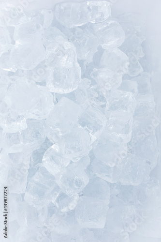 Ice background. Top view of small ice cubes.