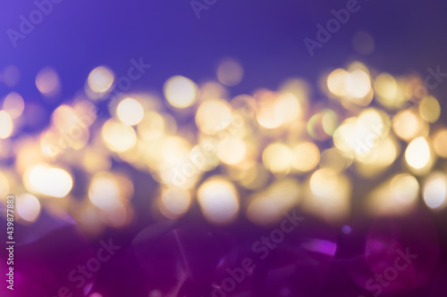 Purple and blue glitter vintage lights background defocused for festivals and celebrations © kaewphoto