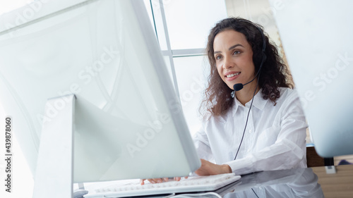 Beautiful woman wearing headsets worker call centre. working customer support service operator. communication in corporate, Business advisor concept.